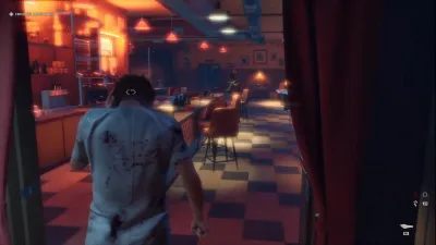 Blood-spattered Michael Myers in a patient gown entering the neon-lit Rabbit in Red diner interior with the Enter the Rabbit in Red objective pinned to the top of the screen