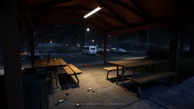 Covered picnic tables in the Orange Grove Estates neighborhood park at night in Halloween: The Game