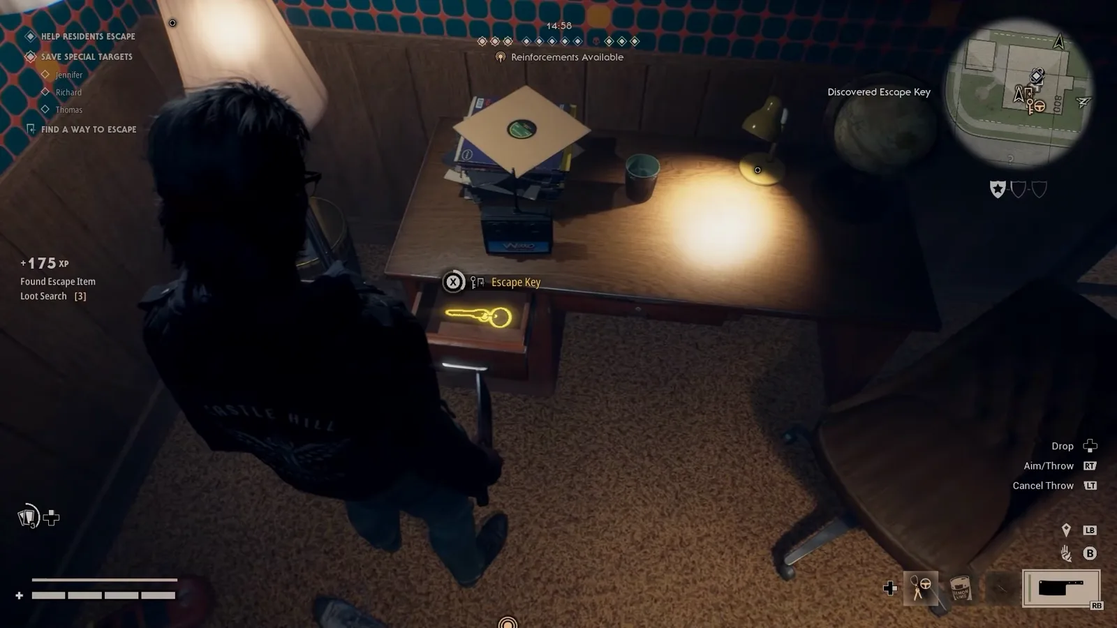 A glowing Escape Key inside an opened desk drawer with the Discovered Escape Key marker in Halloween The Game